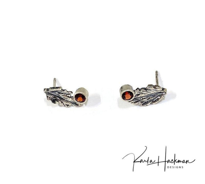 Leaf Studs in Sterling Silver with Gemstones - Karla Hackman DesignsSterling Silver Leaf Studs are Karla's inspired take on her childhood spent playing in the woods. Each piece features a hand-carved oak leaf, with a 3mm peridot gemstone