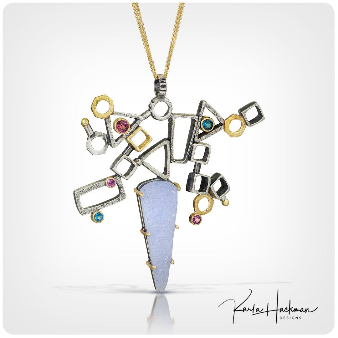 Handcrafted geometric freeform pendant in sterling silver and 14K and 18K gold by Karla Hackman Designs