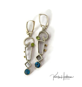 Geometric Statement Earrings in Silver & Gold! Embellished with 18K gold accents and featuring rectangles and cubes and textured elements, 5mm London blue topaz, and 4mm peridot –