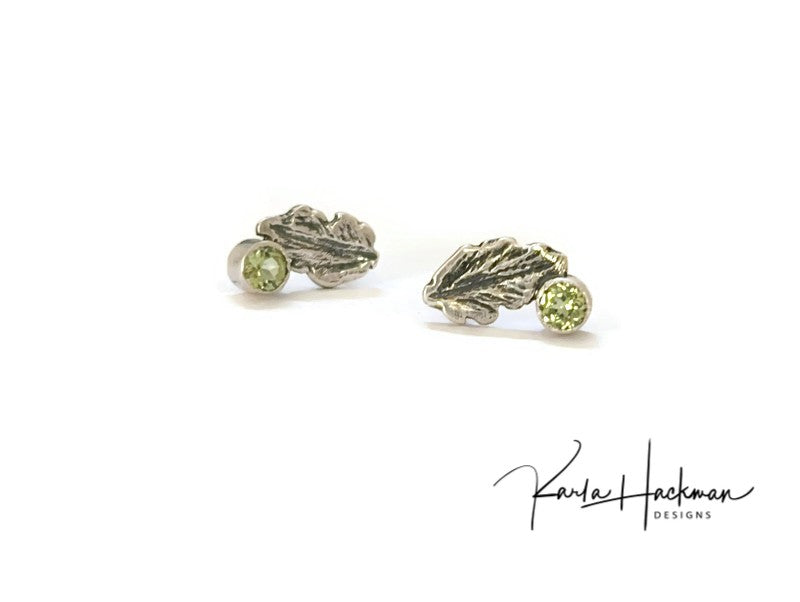 Sterling Silver Leaf Studs are Karla's inspired take on her childhood spent playing in the woods. Each piece features a hand-carved oak leaf, with a 3mm peridot gemstone