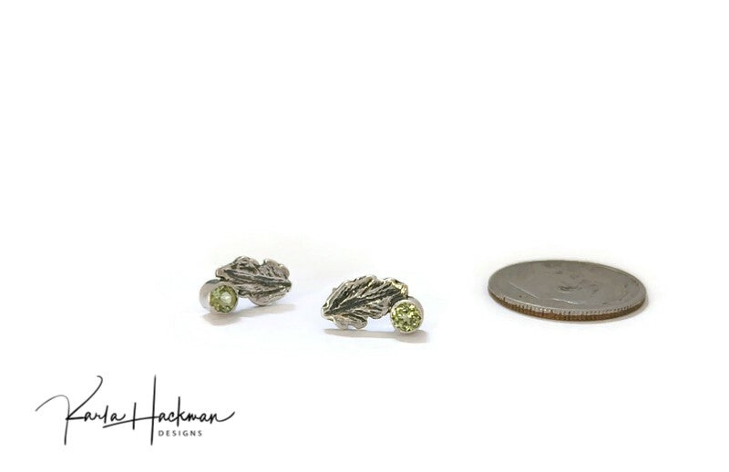 Sterling Silver Leaf Studs are Karla's inspired take on her childhood spent playing in the woods. Each piece features a hand-carved oak leaf, with a 3mm peridot gemstone