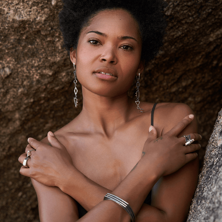 Geometric Long Drop Asymmetrical Shapes in Sterling Silver with gold accents on model