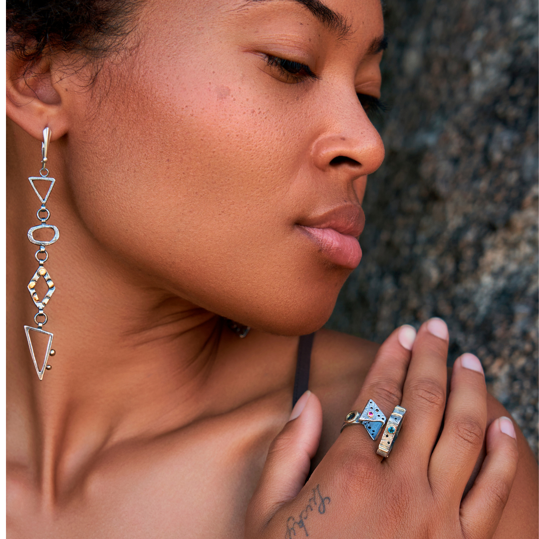 Geometric Long Drop Asymmetrical Shapes in Sterling Silver with gold accents on model