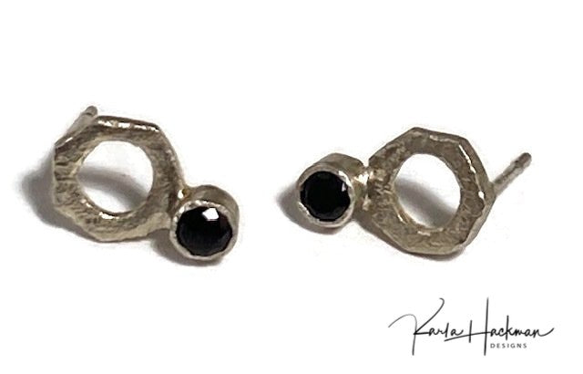 Handcrafted sterling silver washer stud earrings are given a hammered texture, decorated with a 3mm gemstone in red garnet or black spinel, and given a bright finish.  