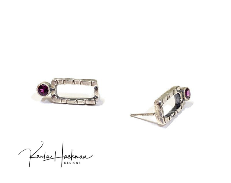 These sterling silver rectangle studs are given a one-of-a-kind texture (each pair will vary slightly), an oxidized finish to highlight the design, and then adorned with a 4mm gemstone, rhodolite garnets or  topaz.