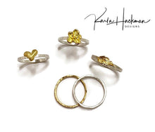 Load image into Gallery viewer, Sterling silver and 18 karat gold are joined in this handcrafted ring, creating this sweet stack ring that is part of the Botanical Collection.  Band is made from sterling silver and heart is carved in wax and cast in 18 karat gold. Picutred with plumeria ring, leaf ring, and silver and gold stacking bands.
