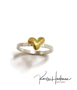 Sterling silver and 18 karat gold are joined in this handcrafted ring, creating this sweet stack ring that is part of the Botanical Collection.  Band is made from sterling silver and heart is carved in wax and cast in 18 karat gold. 
