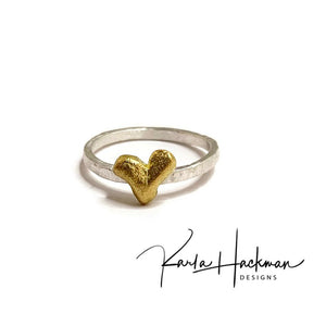 Sterling silver and 18 karat gold are joined in this handcrafted ring, creating this sweet stack ring that is part of the Botanical Collection.  Band is made from sterling silver and heart is carved in wax and cast in 18 karat gold. 