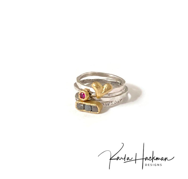 Part of the Botanical Collection, this lovely ring features a sterling silver apple branch as the ring shank and features an18 karat gold thick round setting for a 2.5mm ruby, which is bead set into the gold.   Band is oxidized to highlight the branch texture. This ring can be worn singly or stacked with other rings.