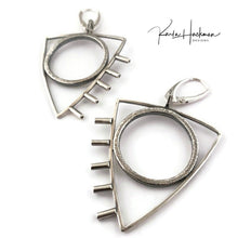 Load image into Gallery viewer, These earrings are a little rock and roll and a whole lot of fun! Large sterling silver, textured circles are surrounded by triangles and finished with tube accents. Earrings are lightly oxidized and finished with lever backs. Solid sterling silver.
